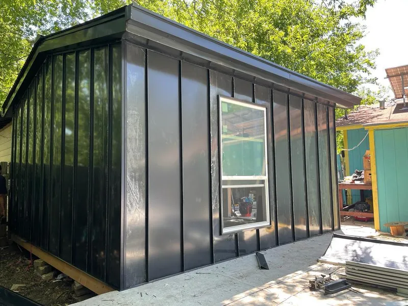 Black standing seam metal wall panels for Roof Inspection in South Windsor