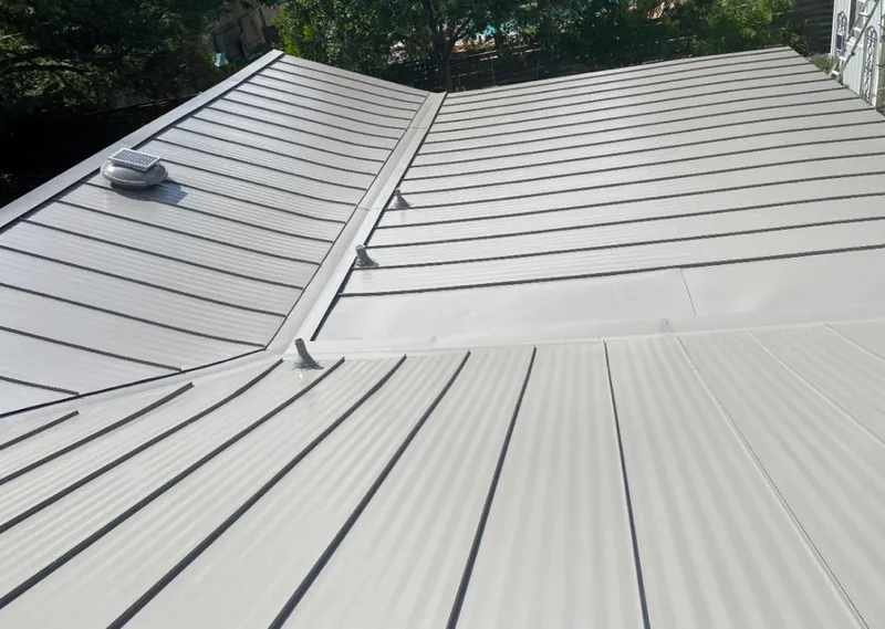 Solar attic fan installed on a metal roof for Roof Ventilation in South Windsor